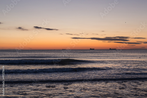 blue sea and clouds in the sky  sunrise on the horizon