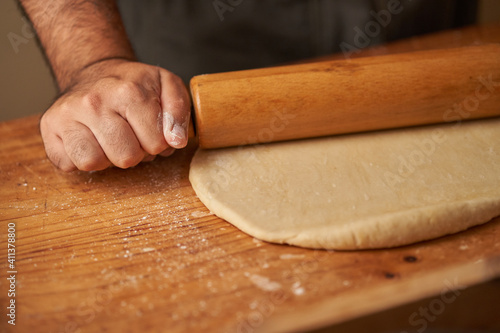 cook kneads his preparation before baking