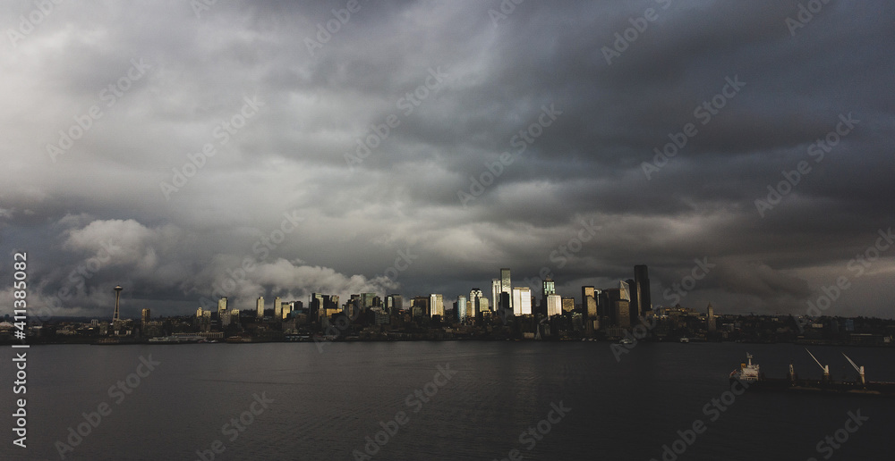 Dark clouds in the sky over the Puget Sound water and the city of Seattle in Washington state. 
