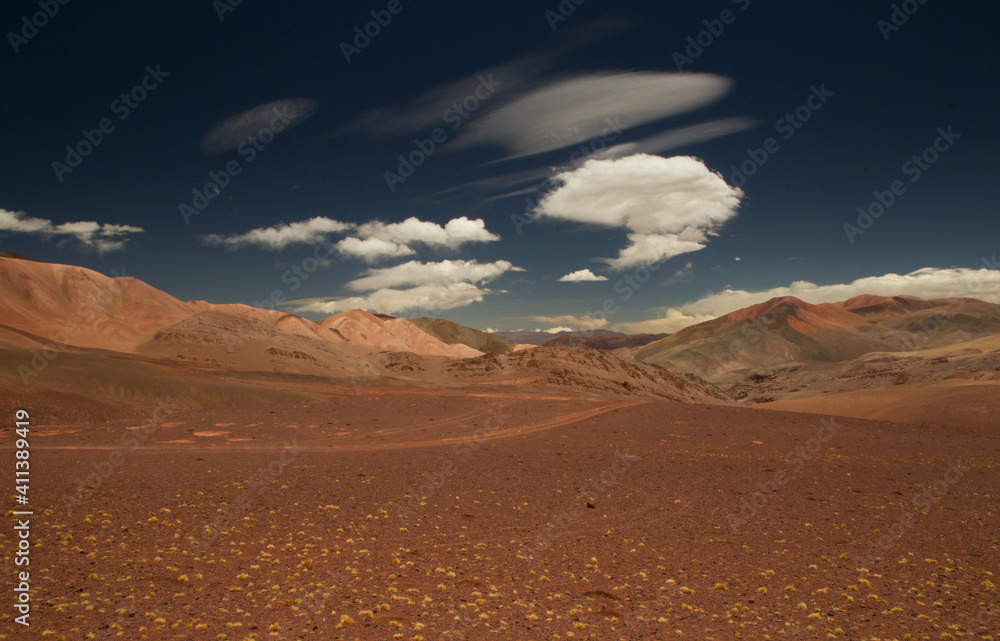 Arid desert landscape high in the Andes mountain range. View of the dunes, brown land and colorful mountains in Laguna Brava, La Rioja, Argentina.