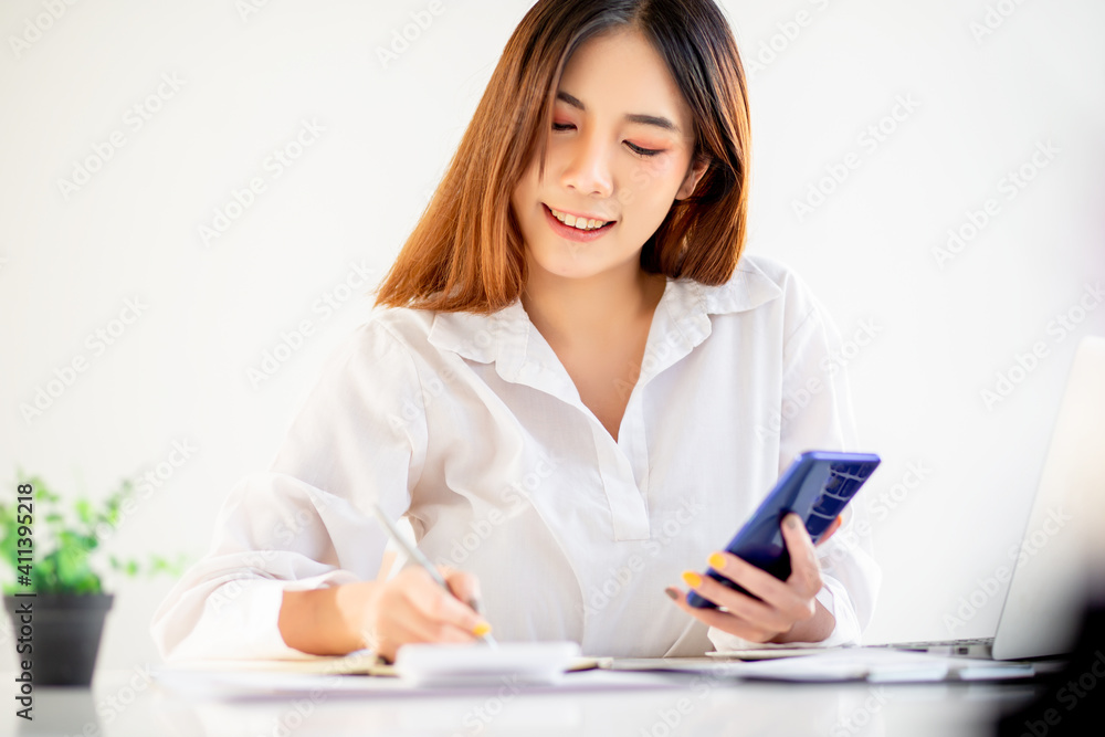 Portrait of Beautiful young woman working on laptop computer, woman work from home .
Portrait of Beautiful young woman working on laptop computer, woman work from home .