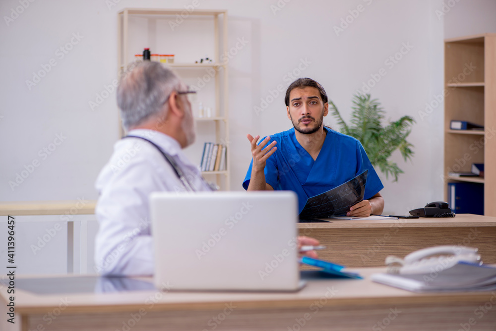 Two doctors working in the clinic Two doctors working in the clinic