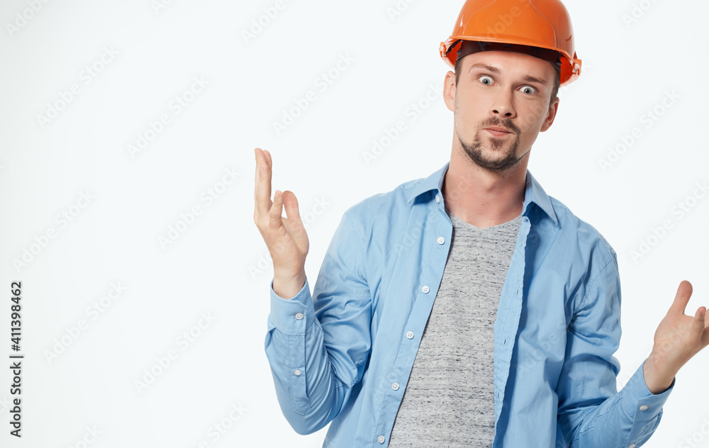 architect in orange helmet and unbuttoned shirt gesturing with hands cropped view white background architect in orange helmet and unbuttoned shirt gesturing with hands cropped view white background