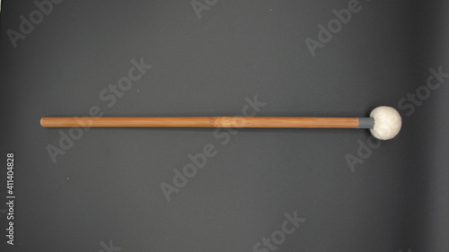 Percussion drumstick on a black background.