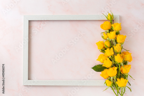 Yellow roses with wooden frame
