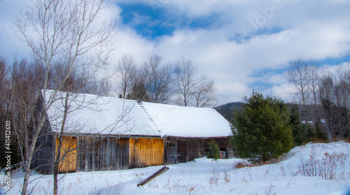 Old barn in a field during Quebec winter in Canada © Gilles Rivest