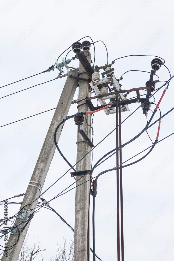 Supports of power lines. Power lines and posts. Detailed close-up. Supports of power lines. Power lines and posts. Detailed close-up.