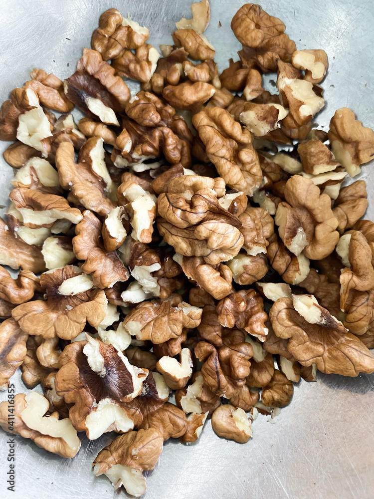 Cracked walnuts on the table. Overhead view of healthy nuts Cracked walnuts on the table. Overhead view of healthy nuts