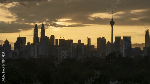 Beautiful Kuala Lumpur landmark during sunset or sunrise, skyscraper skyline view, iconic capital city of Malaysia in time lapse motion. 4k b-roll 