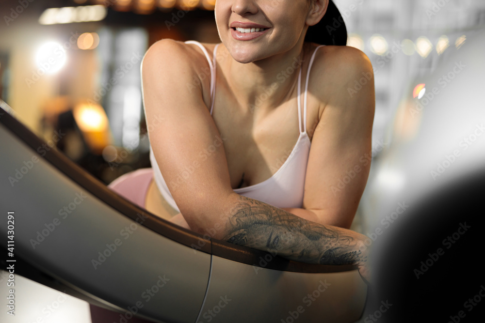Young beautiful caucasian fit strong woman is doing exercises in gym Young beautiful caucasian fit strong woman is doing exercises in gym