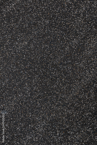 closeup texture of an dark asphalt road, the pattern is looking like a starfield. - vertical