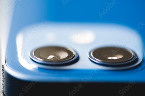 February, 2021: Back view of new blue smartphone. Two lens close up.