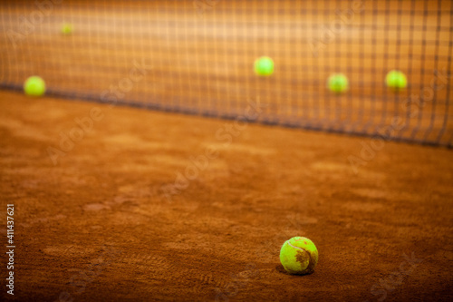 Tennis balls on the tennis court. Tennis game. Sport, recreation concept