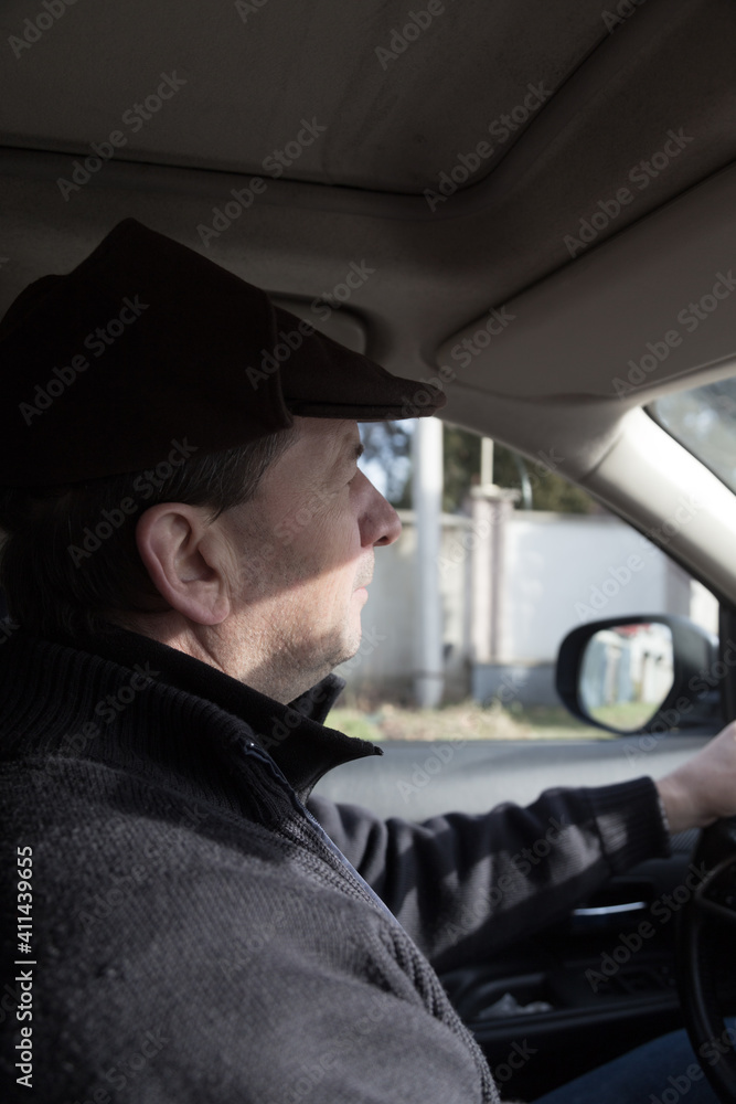 A man drives a car around the city. A man drives a car around the city.