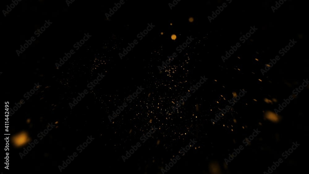 Gold dust particles fly in slow motion in the air lingering slowly. Dust Particles Background Bokeh Lights Background on Black Background 4k Footage Snow Particles Background. Gold dust particles fly in slow motion in the air lingering slowly. Dust Particles Background Bokeh Lights Background on Black Background 4k Footage Snow Particles Background.