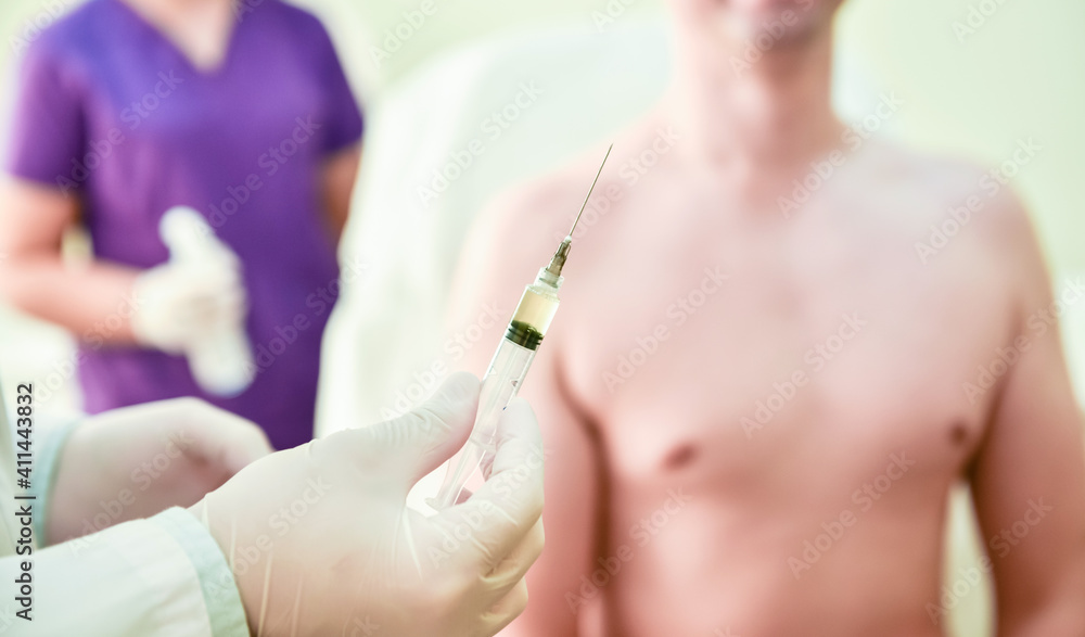 Platelet-Rich plasma preparation. Syringe with plasma in hands Platelet-Rich plasma preparation. Syringe with plasma in hands