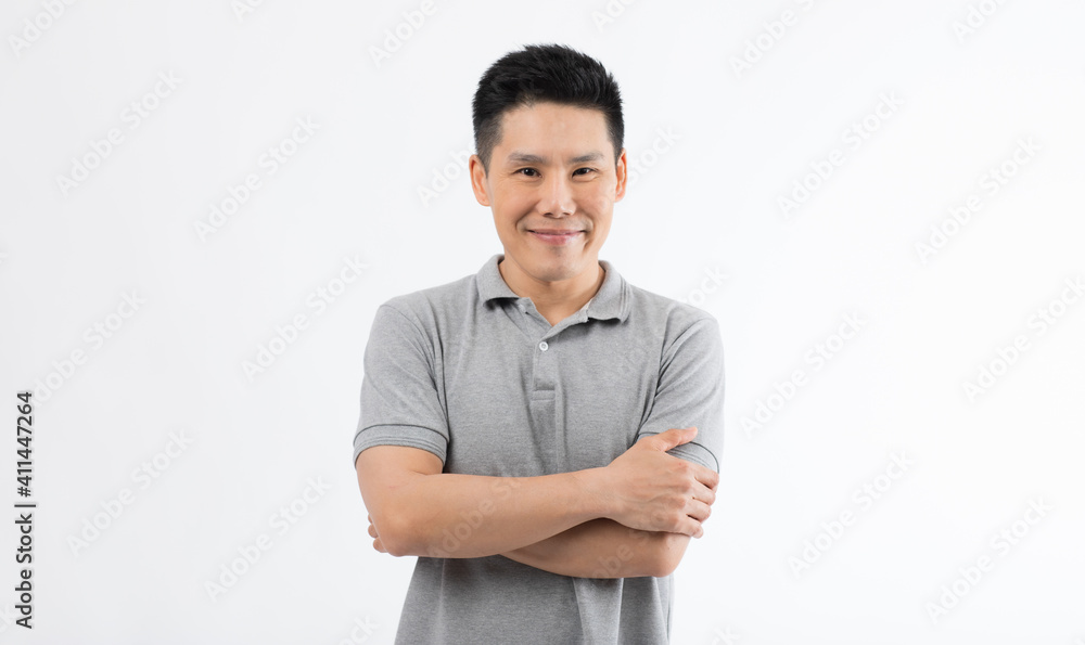 Portrait of Asian man with smile face poses with self-confidence folded arms looking to camera Portrait of Asian man with smile face poses with self-confidence folded arms looking to camera