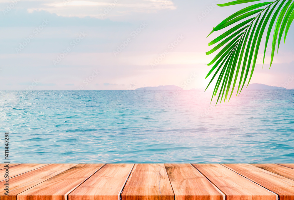 Top of wood table with blurred sea and palm tree background,Concept Summer, Beach, Sea, Relax. Top of wood table with blurred sea and palm tree background,Concept Summer, Beach, Sea, Relax.
