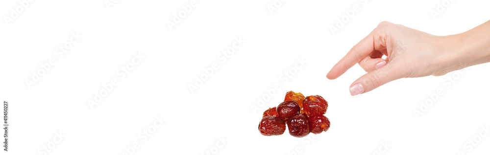 Hand with dried date isolated on white background. Hand with dried date isolated on white background.