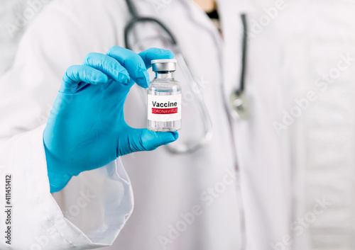 Doctor holding vaccine bottle coronavirus and medical in the hospital