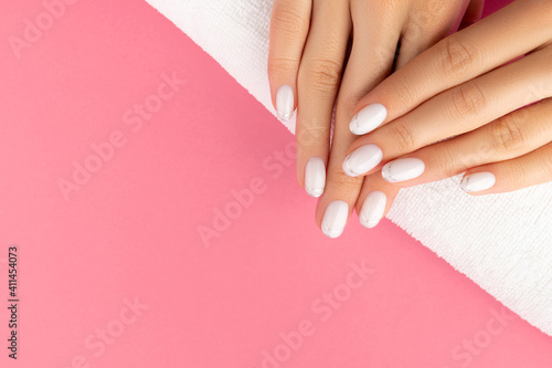 Canvas Print Womans hands with trendy white french manicure