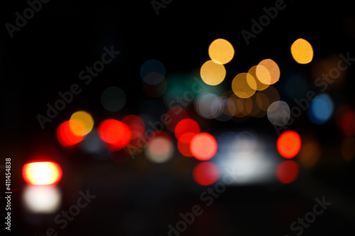 Abstract defocused bokeh lights background. Night city street
