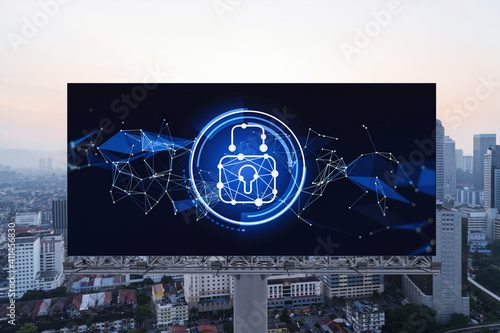 Canvas Print Padlock icon hologram on road billboard over panorama city view of Kuala Lumpur at sunset to protect business, Malaysia, Asia