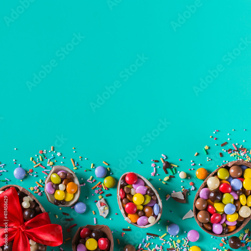 Festive Easter background with chocolate eggs and sweets