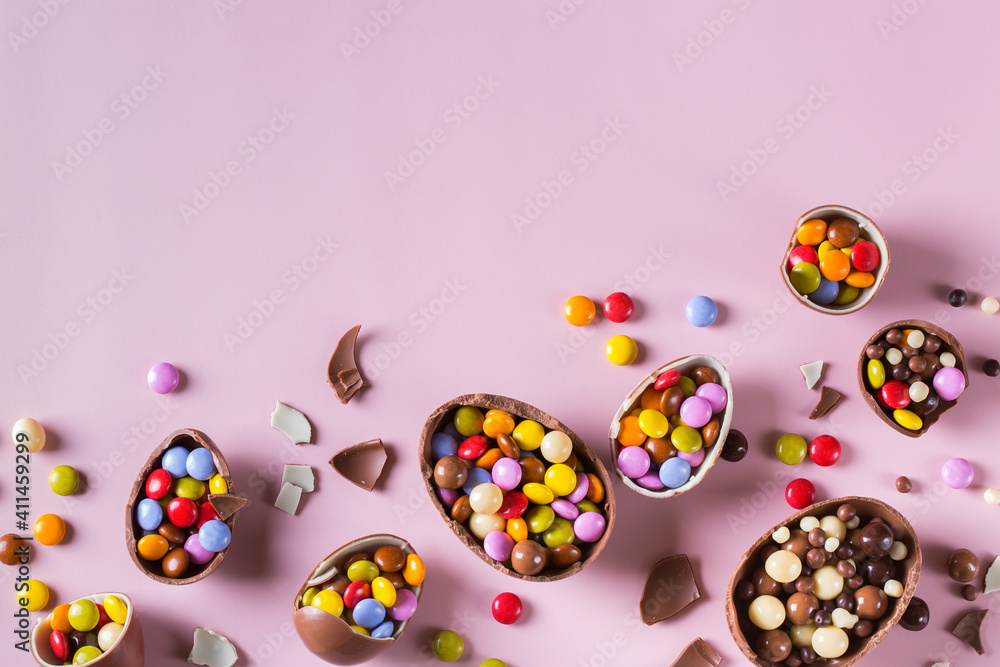 Festive Easter background with chocolate eggs and sweets Festive Easter background with chocolate eggs and sweets
