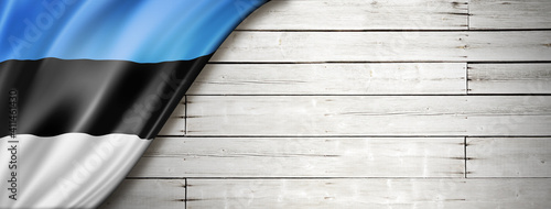 Photos Estonian flag on old white wall banner
