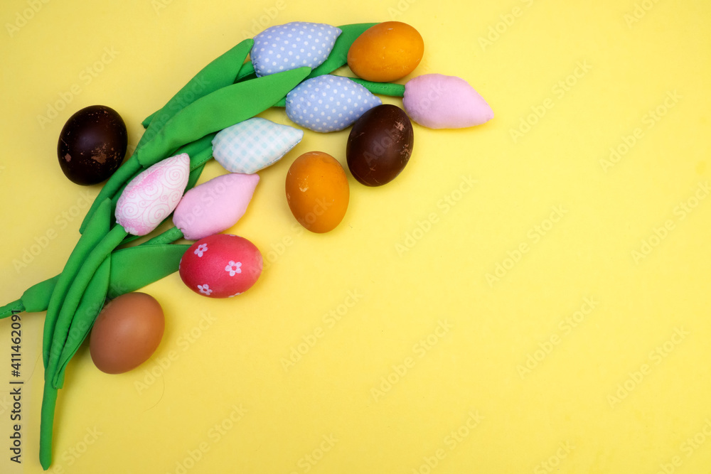 Easter background with painted eggs and colorful tulips. Top view with copy space Easter background with painted eggs and colorful tulips. Top view with copy space