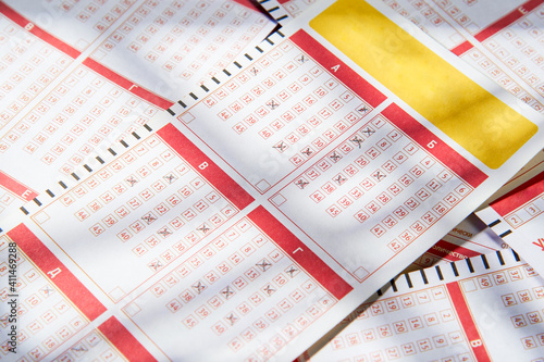 Filled lottery tickets close up, playing lottery or bingo has a chance to win the jackpot. Free space for text.