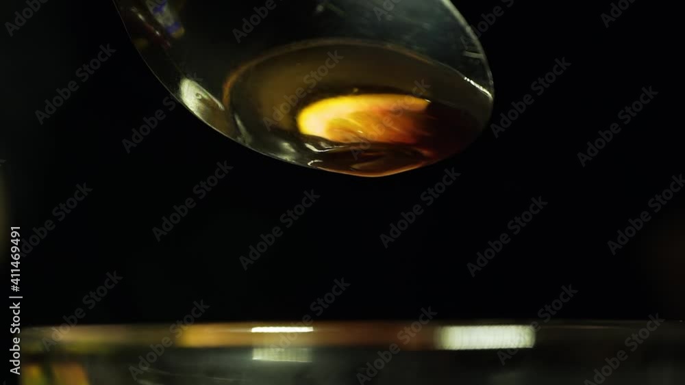 A drop falls into mulled wine in slow motion A drop falls into mulled wine in slow motion