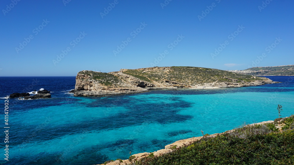 the view of Cominotto Island from the Blue Lagoon on Comino Island, Malta, March