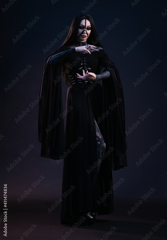 Young woman in black dress in Gothic style Young woman in black dress in Gothic style