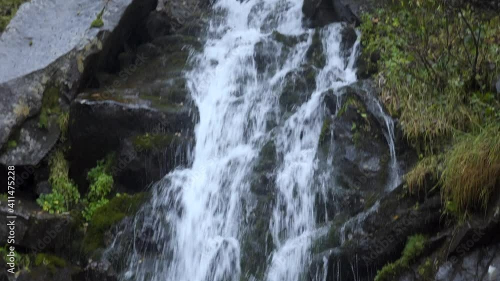 A beautiful waterfall in the Carpathian mountains. Close-up. A beautiful waterfall in the Carpathian mountains. Close-up.