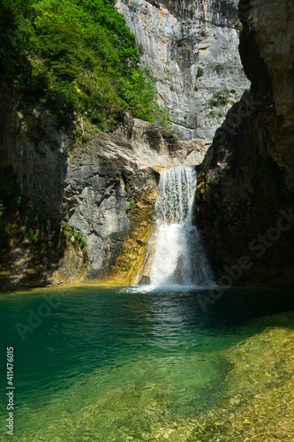 Majestic Hidden Waterfall in Natural Landscape  located in the Aragonese Pyrenees  Huesca  Spain.