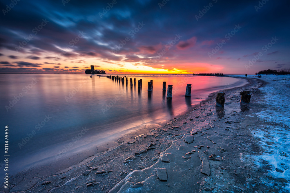 Amazing landscape of frozen beach of baltic Sea in Babie Doly at sunrise. Gdynia, Poland