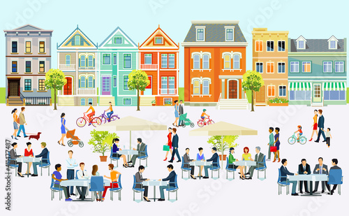 Großer Platz mit Menschen die im freihen vor einem Restaurants und Cafes sitzen