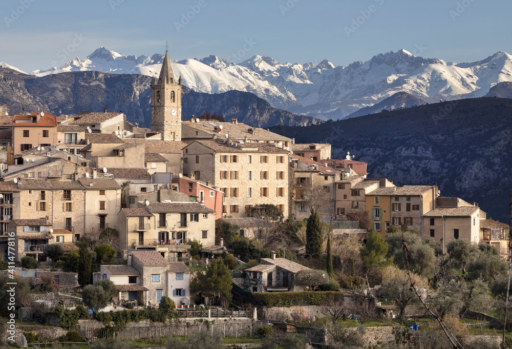 The ancient village of Le Broc in the Maritime Alpes in France with snow on the mountains