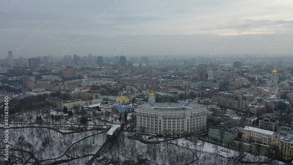 Europe, Kiev, Ukraine - February 2021: aerial view of the Podil area, St. Andrew's Church, Kontraktova Square and Kiev. Old residential buildings overlooking the city.