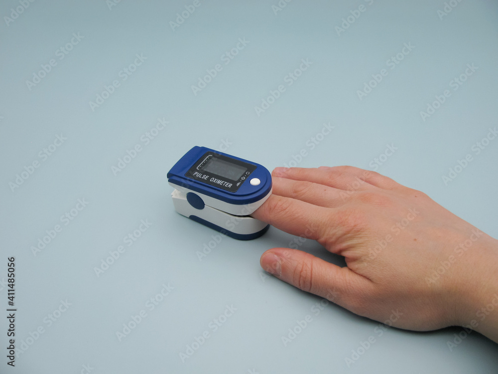 someone measures the level of oxygen saturation of capillary blood with a medical monitoring and diagnostic device, a pulse oximeter. Readings are normal someone measures the level of oxygen saturation of capillary blood with a medical monitoring and diagnostic device, a pulse oximeter. Readings are normal