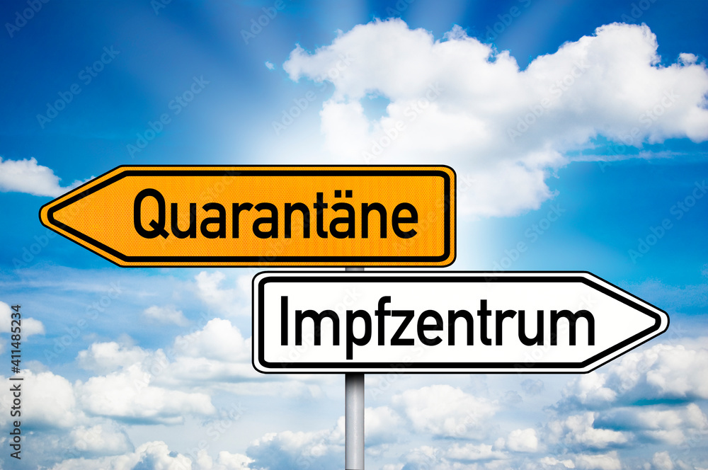 Road sign with the german words for covid-19 vaccination center or centre and quarantine - Quarantäne und Impfzentrum with blue sky background Road sign with the german words for covid-19 vaccination center or centre and quarantine - Quarantäne und Impfzentrum with blue sky background