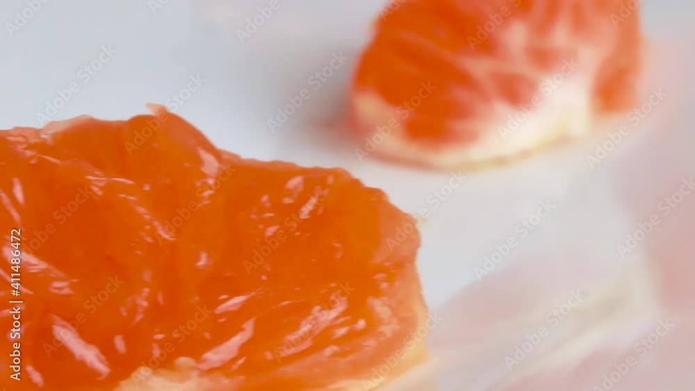 tangerines juicy fruit slices close up macro video camera movement from left to right background out of focus tangerines juicy fruit slices close up macro video camera movement from left to right background out of focus