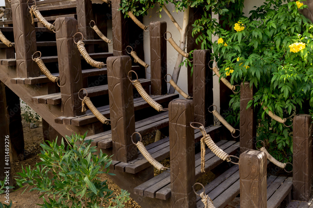 Old rustic wooden stairs in the garden