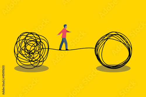 Solution problem concept. Man walking on  tightrope photo