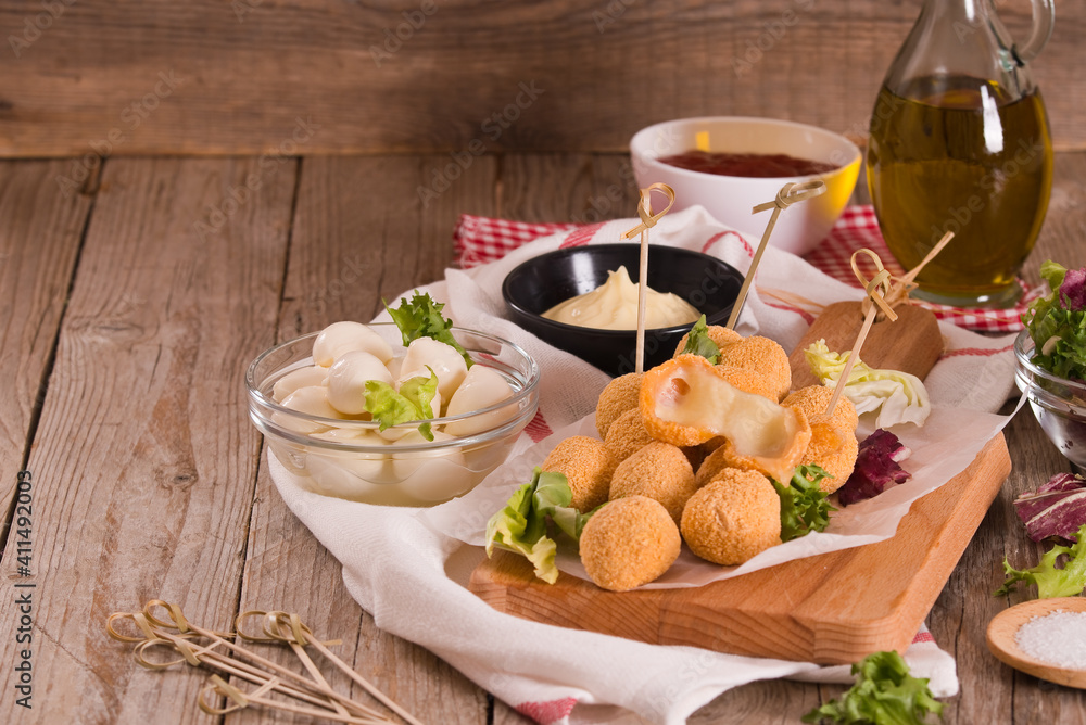 Fried Mozzarella cheese balls.
Fried Mozzarella cheese balls.