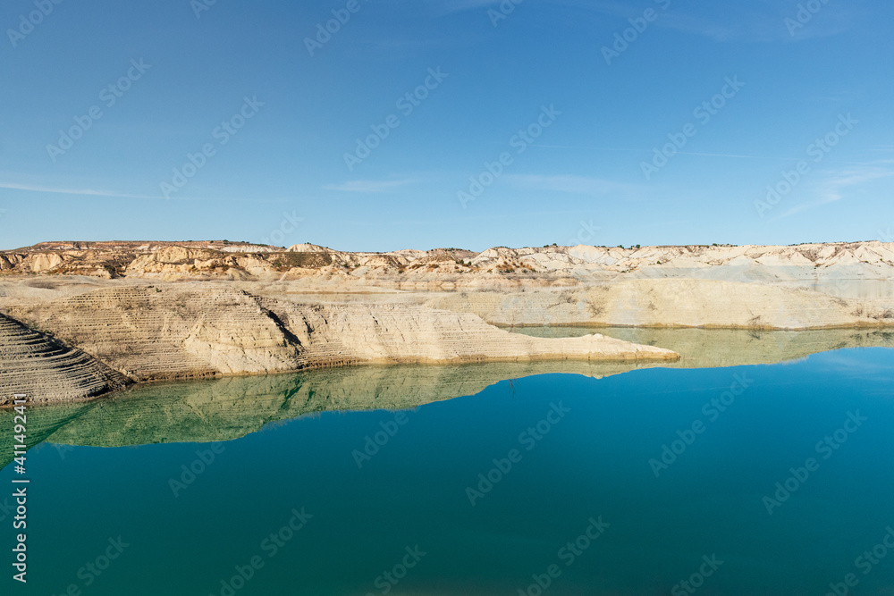 Blue lake in a desert-like area, oasis