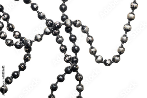 silver beads painted with black paint on a white isolated background