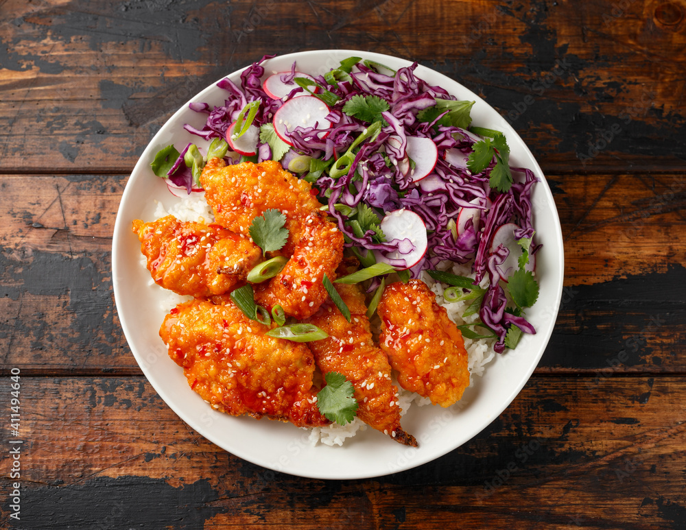Korean Fried chicken with red cabbage salad and white rice. Asian food Korean Fried chicken with red cabbage salad and white rice. Asian food